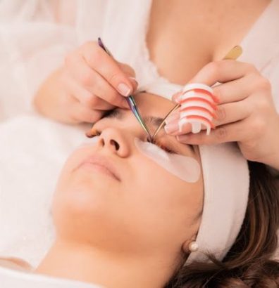 skillful-cosmetologist-doing-lash-extension-procedure-beauty-concept_181624-47009
